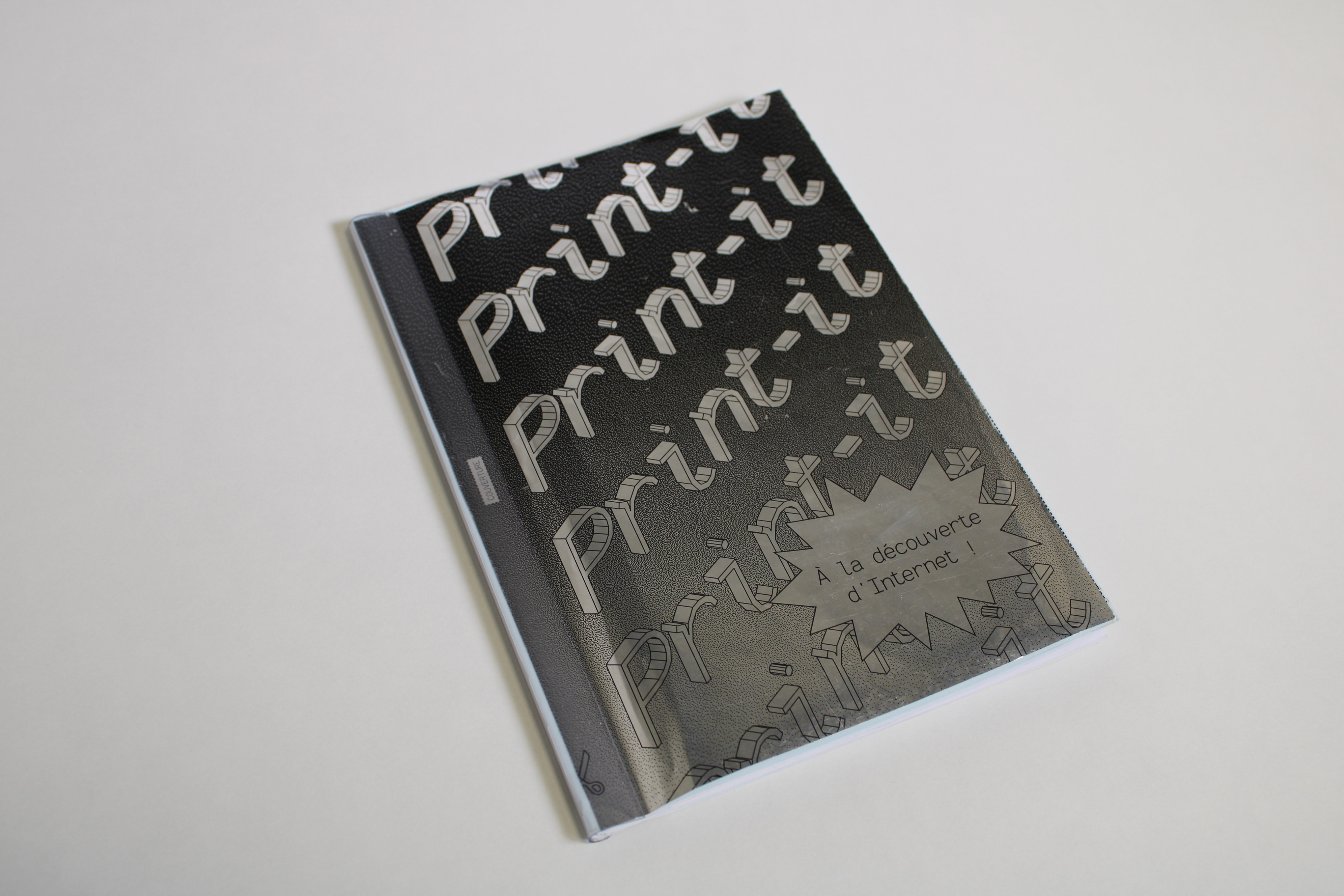 Version payante de Print-It, avec la couverture argentée et la baguette de reliure.